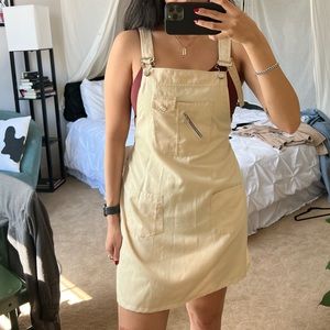 Soft and neutral yellow overall dress
